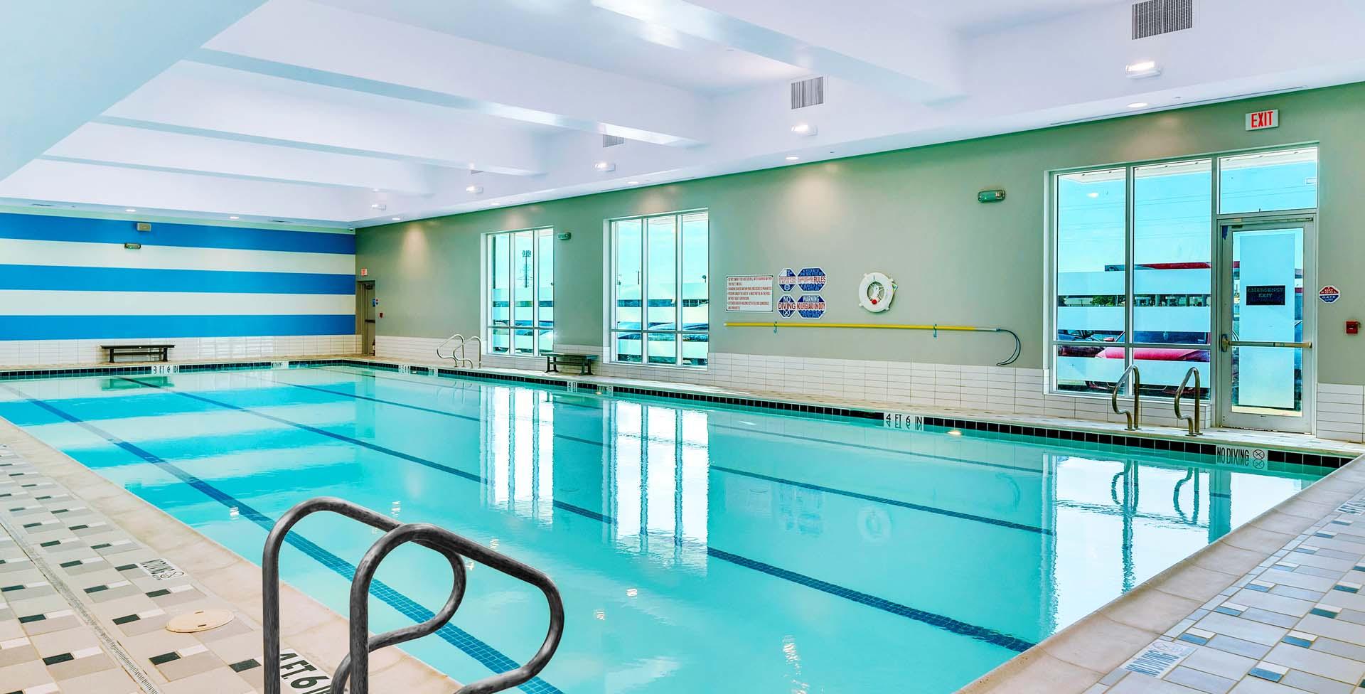 a brightly lit shot of an indoor eos branded pool