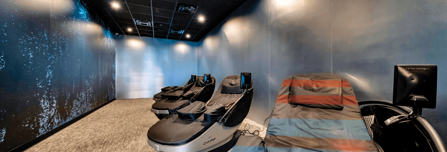 multiple high tech cryo chairs in a well lit eos branded room