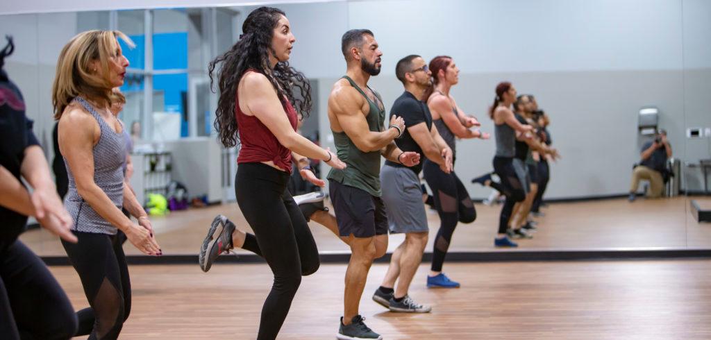 Group of people doing a HIIT workout at the gym